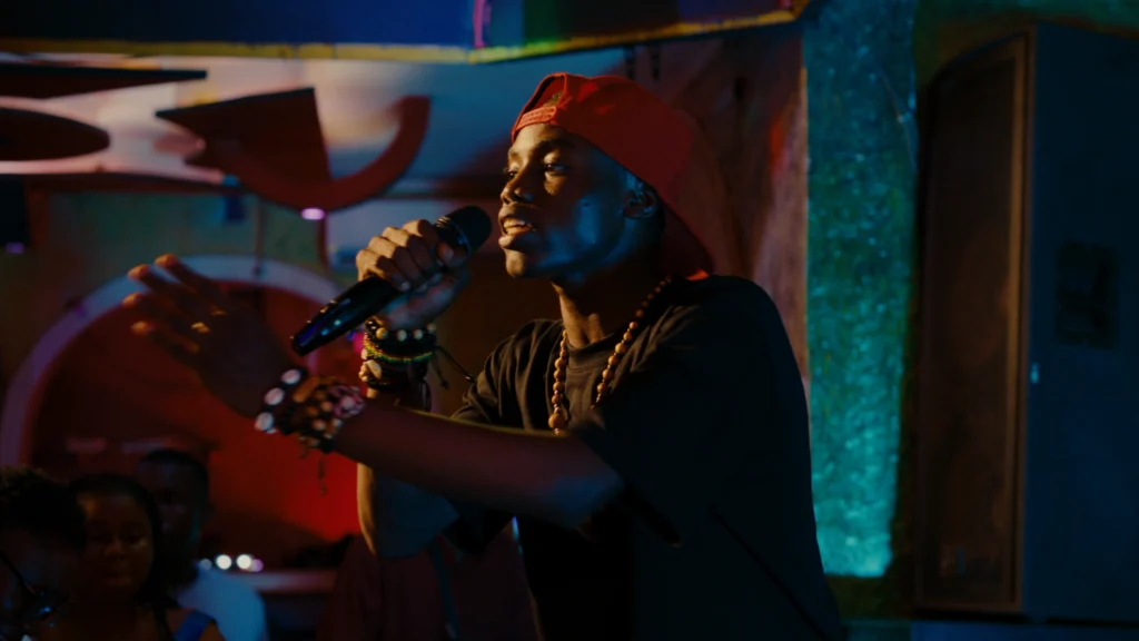 Photograph of the lead actor from Congo Boy performing one of his numbers on stage