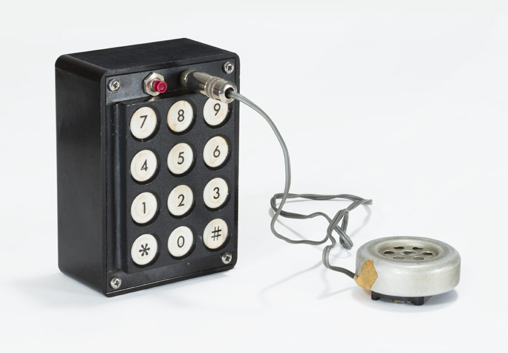 A photograph of a Blue Box, a small hobby-made touchpad device, which were once used to explore telephone networks.